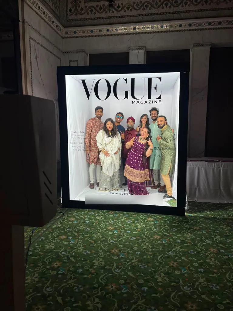 Family in traditional outfits posing inside the Magazine Box