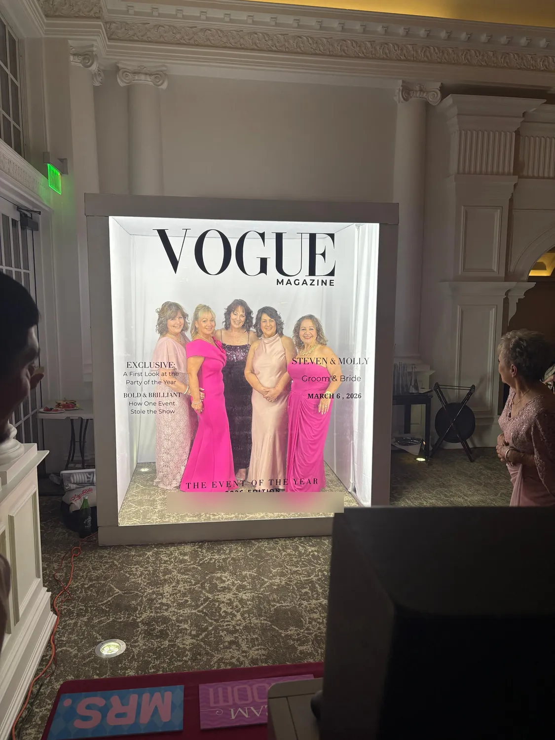 Women in pink gowns inside the Magazine Box